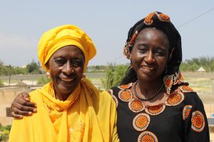 Portait of human rights defender Fatimata Sy with a community member in Thies, Senegal.