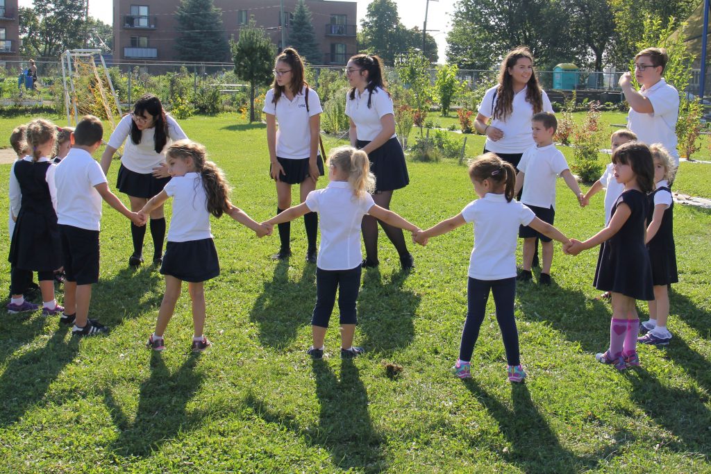 A group of children at EMSB in Montreal playing Equitas Play it Fair activities for inclusion and diversity